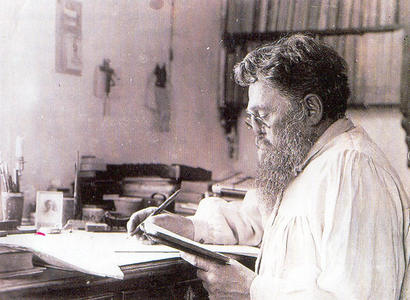 Александр Васильевич Адрианов за письменным столом